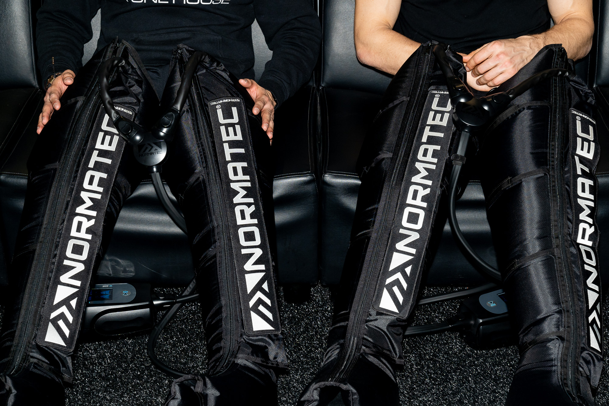 2 Tone House Athletes recovering in NormaTec Boots