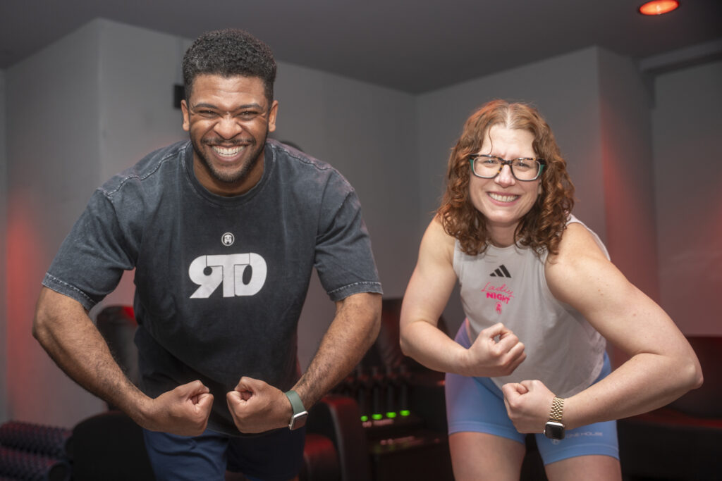 TRANSFORM90 2025 Winners Brendan Nelson and Kimber Myers flexing to the camera.